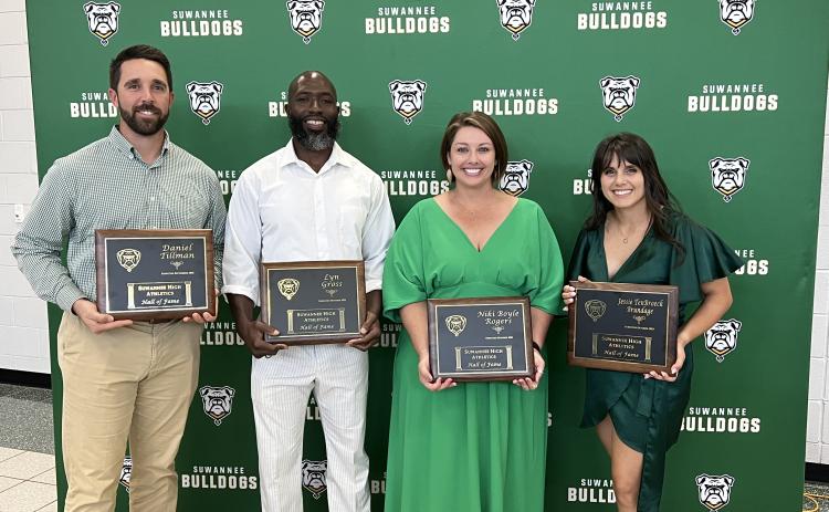 Daniel Tillman (left), a 2022 Suwannee High School Athletics Hall of Fame inductee, joined Class of 2023 inductees Lyn Gross, Niki Boyle Rogers and Jessie TenBroeck Brundage in being honored Thursday during the induction ceremony. Leon Moses, the fourth member of the 2023 class, could not attend. (JAMIE WACHTER/Lake City Reporter)
