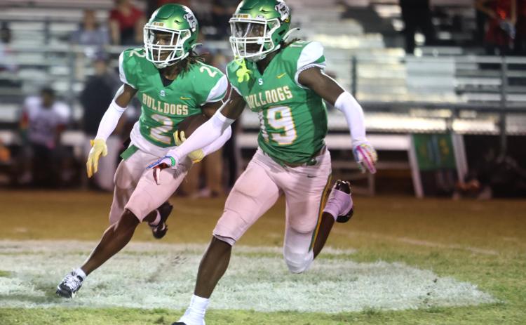 Suwannee defensive back Amarion Rojas (2) returns a kickoff as defensive back Jadarius Horne (19) blocks against Santa Fe last Friday. (PAUL BUCHANAN/Special to the Reporter)