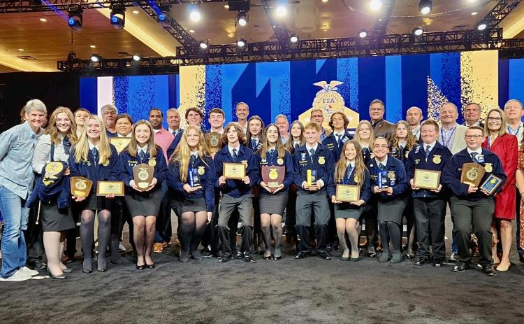 Members of the Fort White FFA chapter are pictured at the state convention. Seven Fort White FFA students travel to Indianapolis next month for the National FFA Convention. (COURTESY)