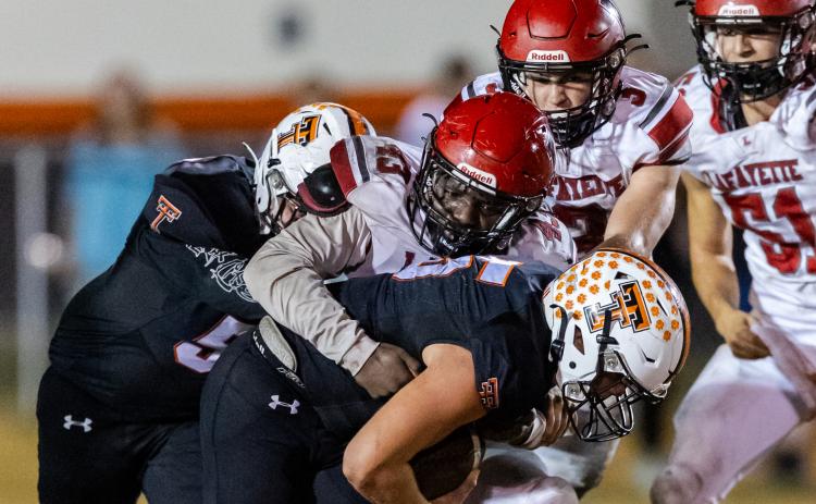Lafayette safety Blake Pilkington makes a tackle against Trenton last Friday. (JACK HOWDESHELL/Special to the Reporter)