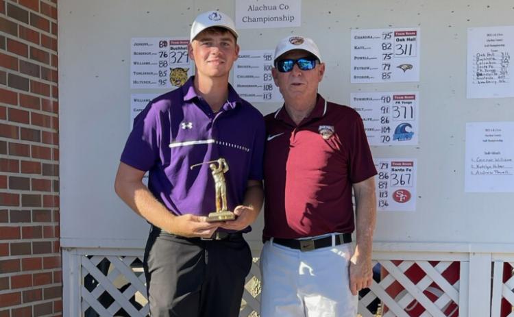 Columbia golfer Connor Williams (left) is above with tournament host Frank Anderson after winning the Ann/John Ives Alachua County Championship on Wednesday.