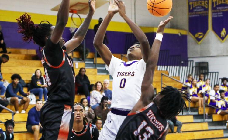 Columbia guard Noah Wilson has the ball knocked away by Raines guard Ta’veon Dunbar during Tuesday’s preseason game. (BRENT KUYKENDALL/Lake City Reporter)