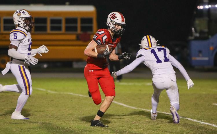 Fort White receiver Garrett Brady makes a Union County defender miss on his way to the end zone for a touchdown during Friday’s Region 3-1R semifinal. (BRENT KUYKENDALL/Lake City Reporter)