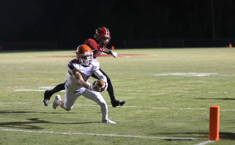 Branford receiver Austin Malaguti stretches across the goal line for a touchdown Friday against Hamilton County. (ERIN ROBERTS/Special to the Reporter)