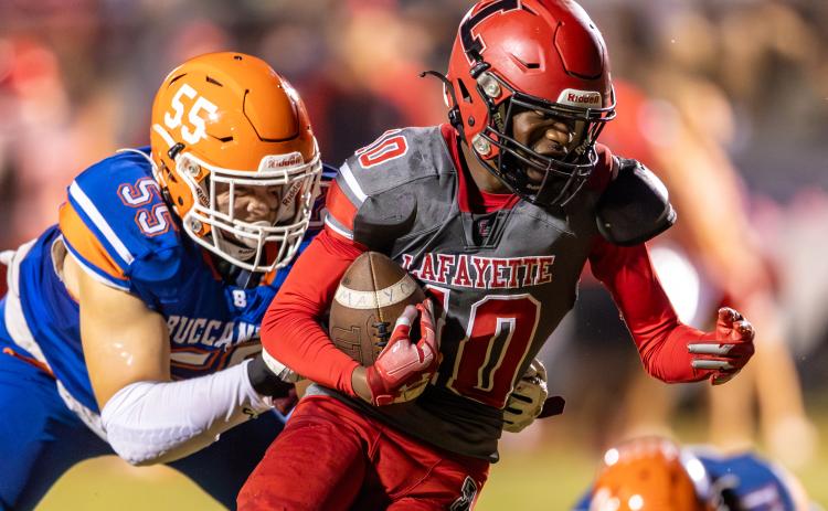 Lafayette receiver Jordan Murphy tries to escape a tackle from Branford defensive lineman Tate Dampier on Sept. 29. (JACK HOWDESHELL/Special to the Reporter)