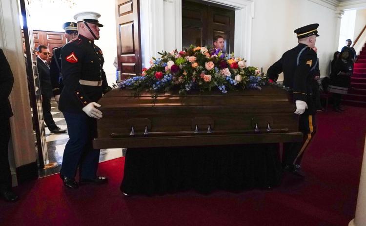 An Armed Forces body bearer team moves the casket for former first lady Rosalynn Carter into Glenn Memorial Church at Emory University for a tribute service on Tuesday in Atlanta. (BRYNN ANDERSON/Associated Press)