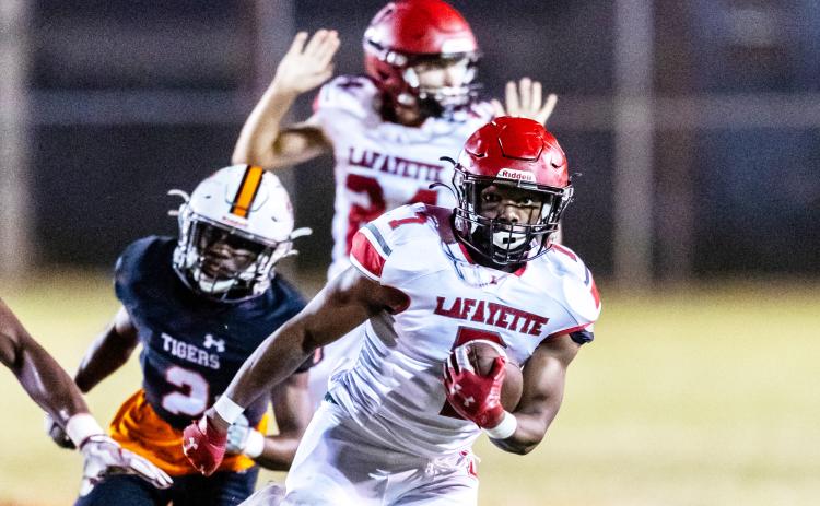 Lafayette’s Ja’marien Ervin returns an interception for a touchdown against Trenton on Oct. 20. (JACK HOWDESHELL/Special to the Reporter)