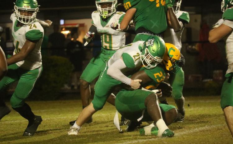 Suwannee defensive lineman Hunter Watson wraps up Pensacola Catholic running back Nigel Nelson on Friday night. (JAMIE WACHTER/Lake City Reporter)