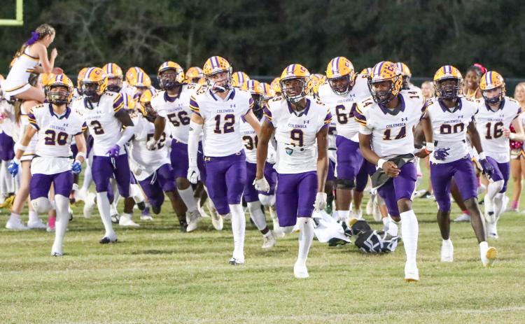 Columbia’s football team takes the field prior to a matchup against Ridgeview on Oct. 27. (BRENT KUYKENDALL/Lake City Reporter)