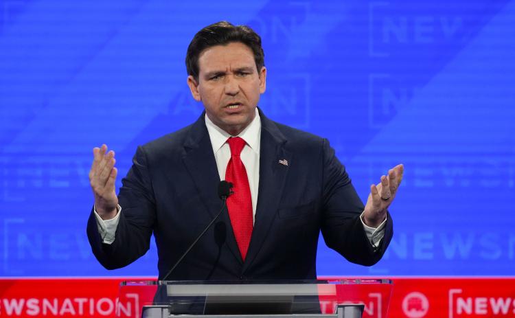 Republican presidential candidate Florida Gov. Ron DeSantis gestures during a Republican presidential primary debate hosted by NewsNation on Wednesday at the Moody Music Hall at the University of Alabama in Tuscaloosa, Ala. (GERALD HERBERT/Associated Press)