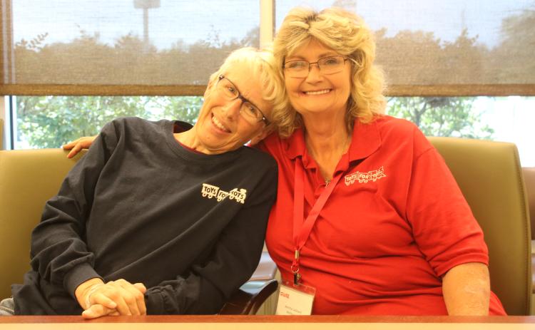 Inga Dwyer, the Toys for Tots coordinator for Columbia, Hamilton and Lafayette counties, (left) and Annita Leonard, the coordinator of Toys for Tots in Suwannee County, are looking forward to the Pilots With Presents Fly In & Antinque and Classic Car Display on Saturday at the Lake City Gateway Airport. (TONY BRITT/Lake City Reporter)