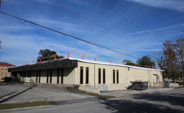 O’Neal Roofing is working on the roof of the old Lake City Reporter building, which Columbia County purchased earlier this year. (TONY BRITT/Lake City Reporter)