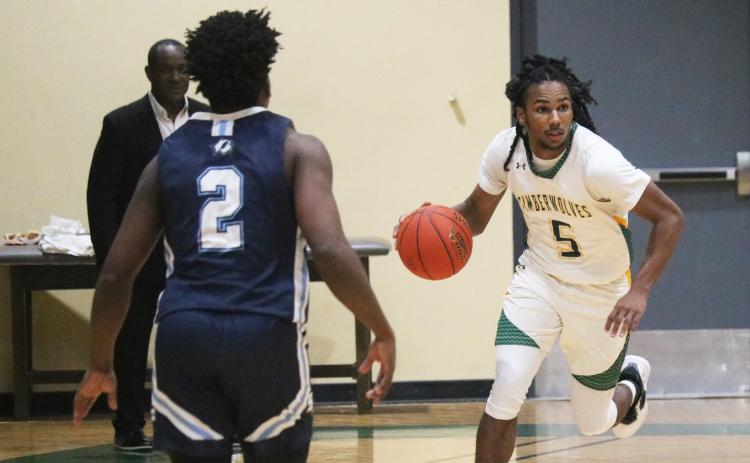 FGC guard Amayoa’ah Phillips dribbles the ball up the floor against Santa Fe College on Dec. 7. (JORDAN KROEGER/Lake City Reporter)