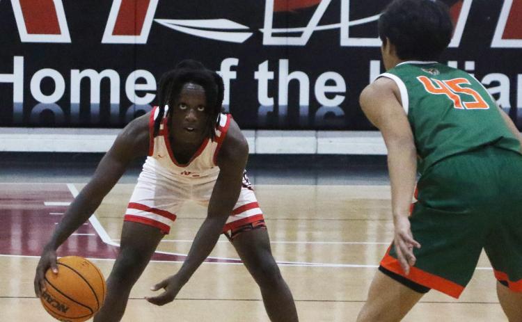 Fort White guard Najeeb Smith runs the offense against Eastside on Dec. 22. (MORGAN MCMULLEN/Lake City Reporter)