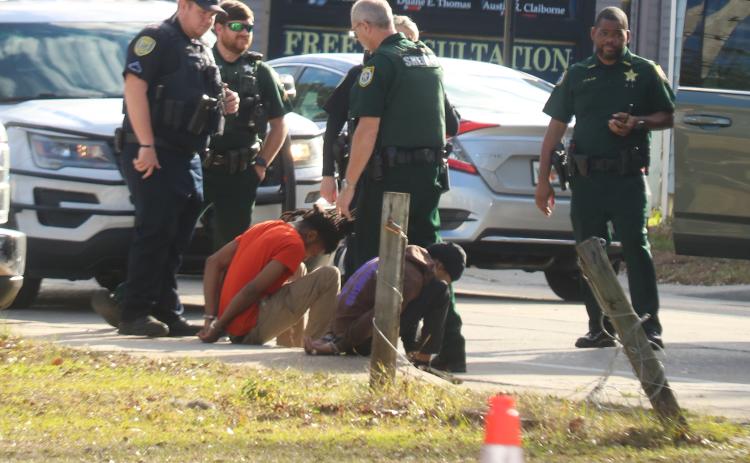 Two individuals are detained following the crash Wednesday afternoon. A suspect was taken into custody but their name was not released Wednesday. (TONY BRITT/Lake City Reporter)