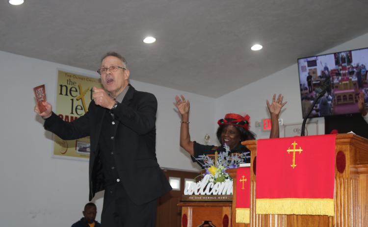 Henry Ortiz, pastor of Olivet Missionary Baptist, addresses the audience as the keynote speaker for the MLK Memorial Service on Monday afternoon. (TONY BRITT/Lake City Reporter)