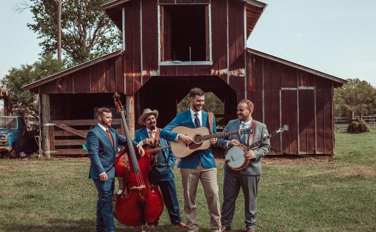 The Flattlanders, which includes Lake City’s Brian Andrews (second from right), Matt Melton (from left), Joey Lazio and Andy Kennan, placed fourth in the Society for the Preservation of Bluegrass Music in America national band competition this past weekend in Nashville. (COURTESY)
