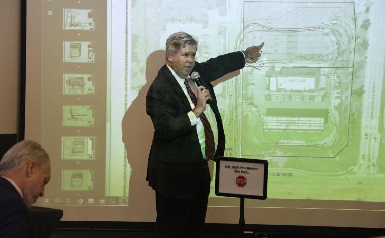 Lake City-based attorney Guy Norris points to a rendering of the proposed expansion at Circle K during a hearing with the Planning and Zoning Board last week. (FILE)