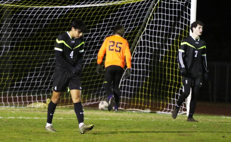 Columbia defender Diego Garcia (4) and midfielder Wesley Wingate (7) make their way back to midfield as goalie Augustus Mock gets the ball out of the net following Leon’s first goal on Wednesday night. (MORGAN MCMULLEN/Lake City Reporter)