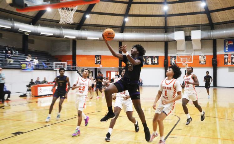 Columbia forward Zavian Douglas goes up for a shot against Orange Park on Friday night. (MORGAN MCMULLEN/Lake City Reporter)