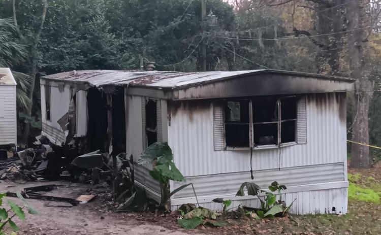 One person was sent to the hospital after a mobile home on NW Ridgewood Avenue caught fire Monday morning. (TONY BRITT/Lake City Reporter)