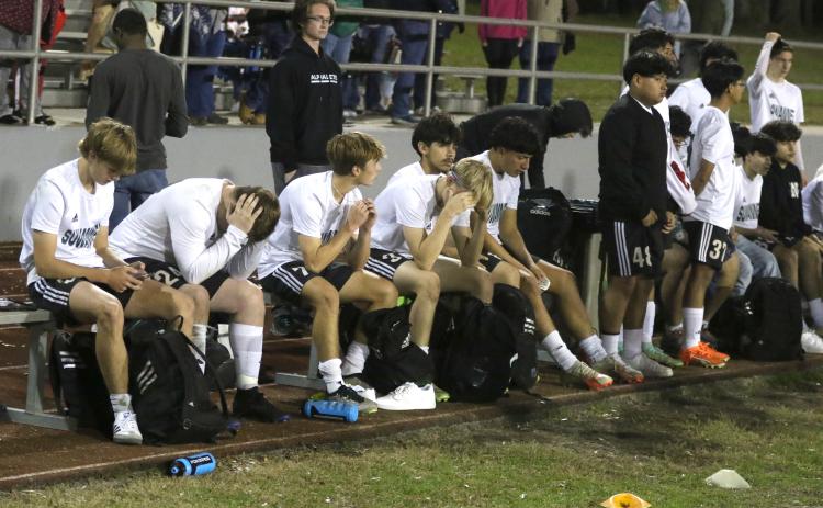 Suwannee’s bench sits disappointed after dropping a 3-1 decision in Tuesday’s District 2-4A championship match. (MORGAN MCMULLEN/Lake City Reporter)