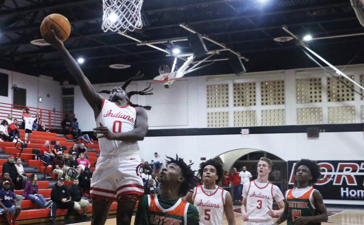 Fort White guard Najeeb Smith makes a layup against Eastside on Dec. 22. (MORGAN MCMULLEN/Lake City Reporter)