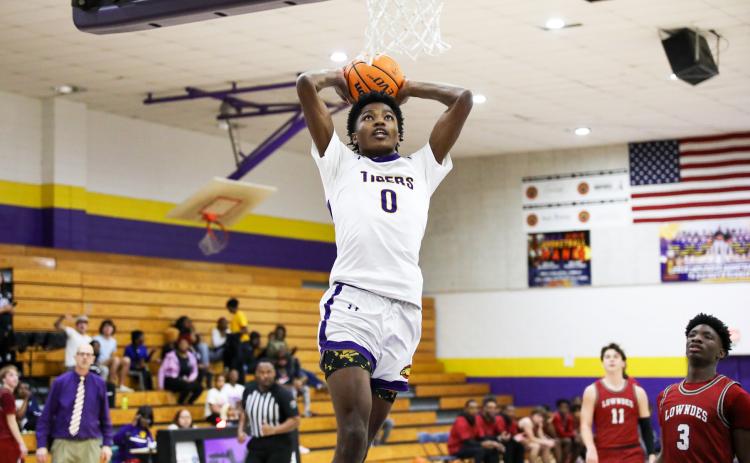 Columbia guard Noah Wilson rises for a dunk against Lowndes on Tuesday night. (BRENT KUYKENDALL/Lake City Reporter)