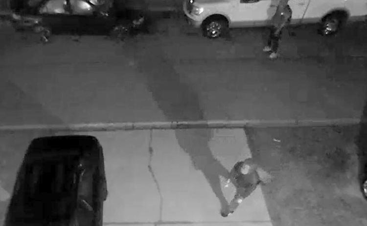 A still image from video surveillance released by the Lake City Police Department shows suspects checking out vehicles to burglarize. (COURTESY)