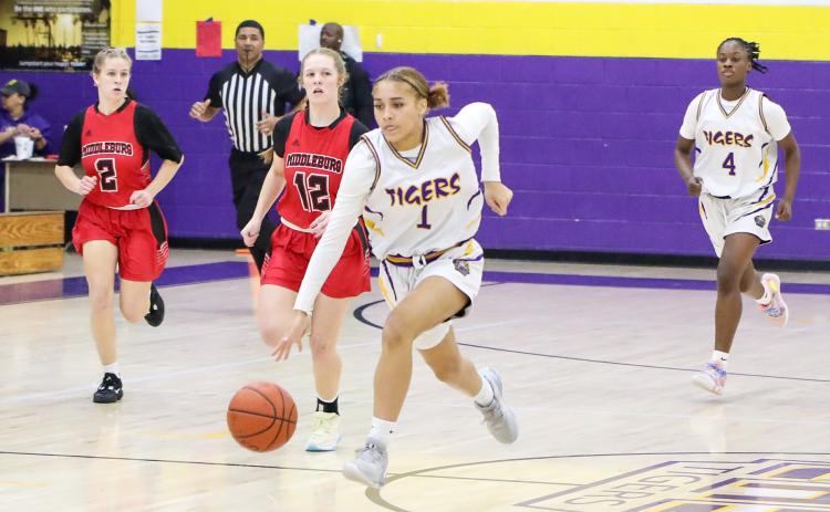 Columbia guard Mariah Cox dribbles up the court in transition after a steal against Middleburg in the District 2-5A quarterfinals on Monday night. (BRENT KUYKENDALL/Lake City Reporter)