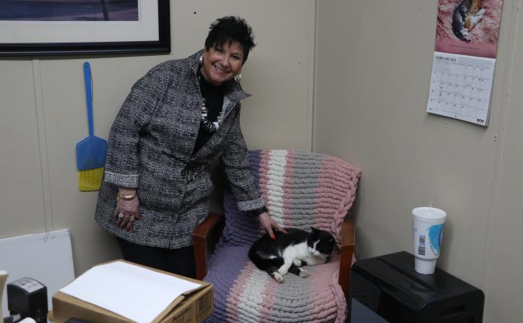 Lake City Humane Society Executive Director Elizabeth Halloran alongside the agency’s office cat, Scruffy, in her office. (MORGAN MCMULLEN/Lake City Reporter)