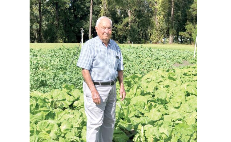 Wayne Morrell, who founded Morrell’s Furniture and Mattresses 60 years ago, is celebrating his 100th birthday today. Morrell is pictured in his garden, which he has shared with the public the past three years. (COURTESY)