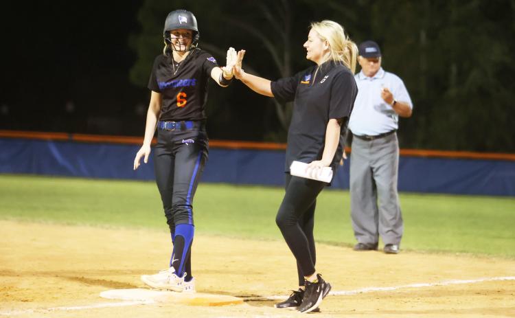 Branford's Madyson Sikes high fives an assistant coach duirng a game last season. (PAUL BUCHANAN/Special to the Reporter)