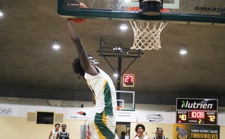 FGC forward Ty'jahn Wright rises to the basket for a dunk against Thomas University JV on Thursday night. (JORDAN KROEGER/Lake City Reporter)