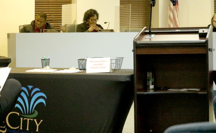 A table is set up next to the speaker’s lectern at Lake City Hall on Monday. City officials set up tables to keep residents away from the dais for Monday’s meeting. (JAMIE WACHTER/Lake City Reporter)