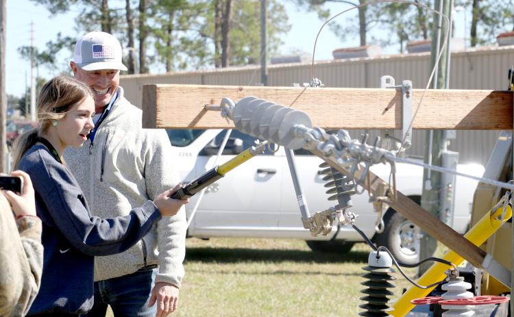 An area high school student tries her hand on working with electric lines at the Clay Electric Cooperative booth at the 2022 Build My Future event. This year’s event is Wednesday at the Florida Gateway Fairgrounds. (FILE)