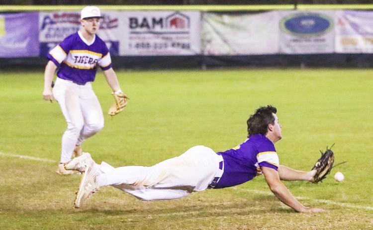 Columbia third baseman Brett Jones can’t track down a pop up that lands just inside the foul line during Friday’s game against St. Johns Country Day. (BRENT KUYKENDALL/Lake City Reporter)