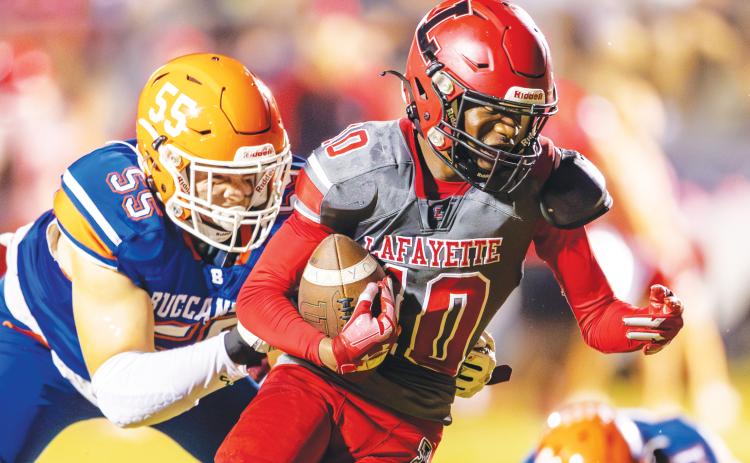 Lafayette receiver Jordan Murphy tries to escape a tackle from Branford defensive lineman Tate Dampier last Friday. (FILE)