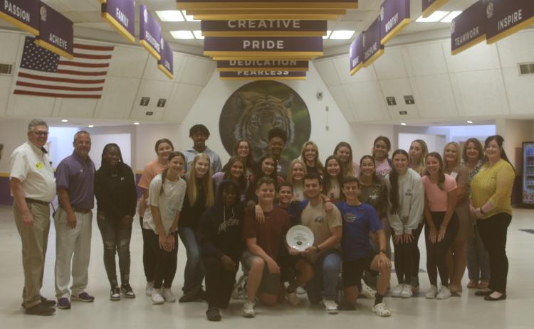 Columbia High School students received the ‘Dinner Plate Award’ on Monday from Catholic Charities and Florida Gateway Food Bank officials. CHS won the award for collecting the most food last fall during the Thanksgiving food drive. (JAMIE WACHTER/Lake City Reporter)