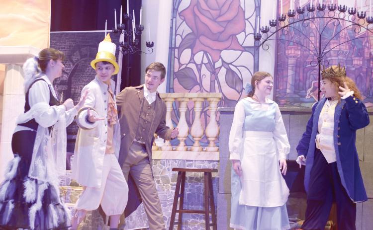 Fort White High School thespians Gracie Norman (from left), Mason Steele, Casey Dettman, Gracey Ayers and Juliette Torres, rehearse a scene for the school’s upcoming production of Beauty and The Beast. The production is the first musical in the school’s history and the first production in the school’s new performing arts center. (TONY BRITT/Lake City Reporter)