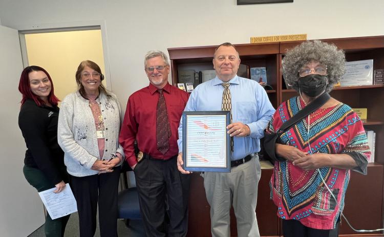 LCPD Community Relations Coordinator Ashley Hardison (from left), Sue Tuell, Assistant Police Chief Andy Miles, Chief Gerald Butler and Bernice D. Presley pose after Butler was presented with a Certificate of Appreciation. (COURTESY)