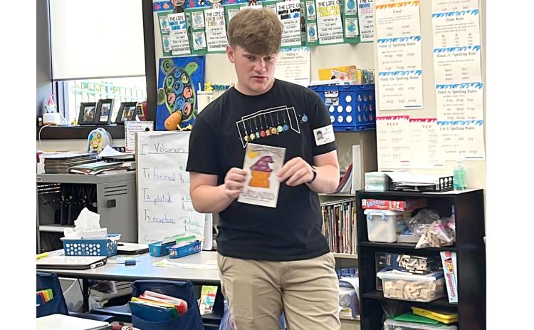 Jacob Sheldon reads his book, ‘I Think My Cat’s A Wizard’ to students at Belmont Academy. (COURTESY)