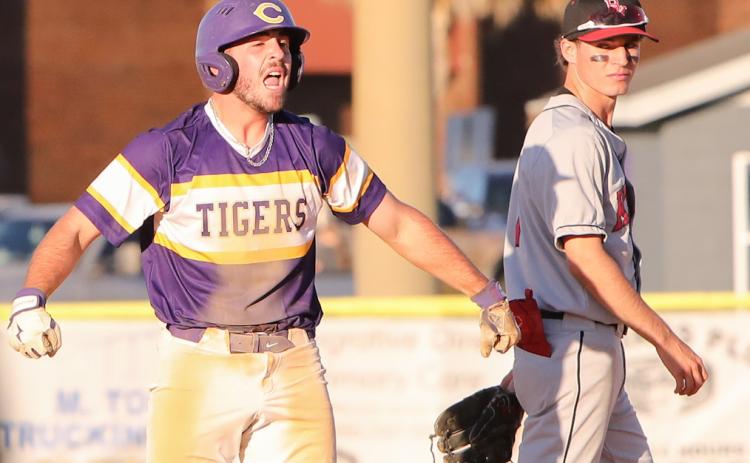 Columbia catcher Casen Maddox celebrates at second base next to Bishop Kenny second baseman Troy Ancayan after hitting a go-ahead 2-RBI double in the sixth inning of Friday’s 8-7 win. (BRENT KUYKENDALL/Lake City Reporter)