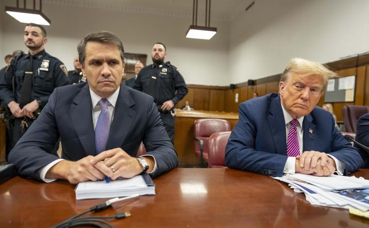 Former President Donald Trump (right) sits with his attorney Todd Blanche during his criminal trial as jury selection continues at Manhattan Criminal Court on Friday in New York City. (Mark Peterson/Pool/Getty Images/TNS)
