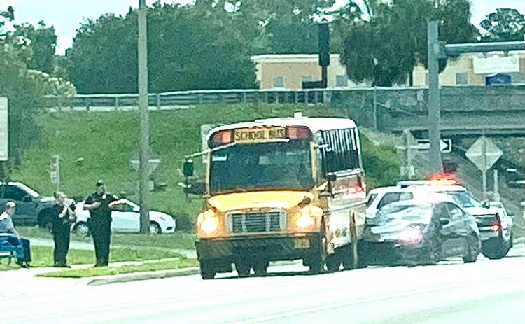A Columbia County school bus sits on U.S. Highway 90 after it was rear-ended by a car Wednesday afternoon. No students were on board the bus at the time. (TODD WILSON/Lake City Reporter)