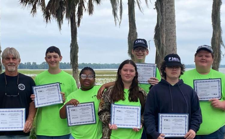 Columbia High teacher Scott Dockery took a group of his building trades and construction design technology students to an industry leadership conference last month. (COURTESY)