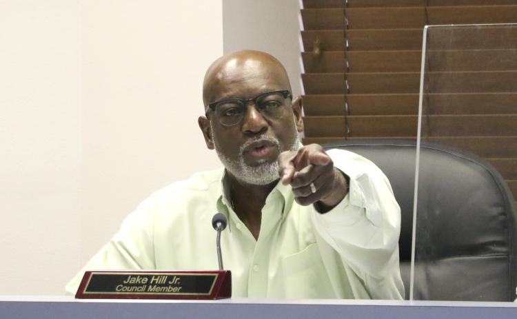 Councilman Jake Hill points toward Glenel Bowden during discussions Monday regarding city council raises. (MORGAN MCMULLEN/Lake City Reporter)