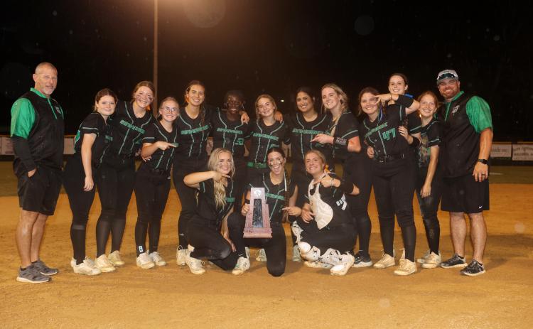 The Suwannee Bulldogs pose with the District 2-3A championship trophy after defeating Florida High 4-1 on Thursday. (PAUL BUCHANAN/Special to the Reporter)