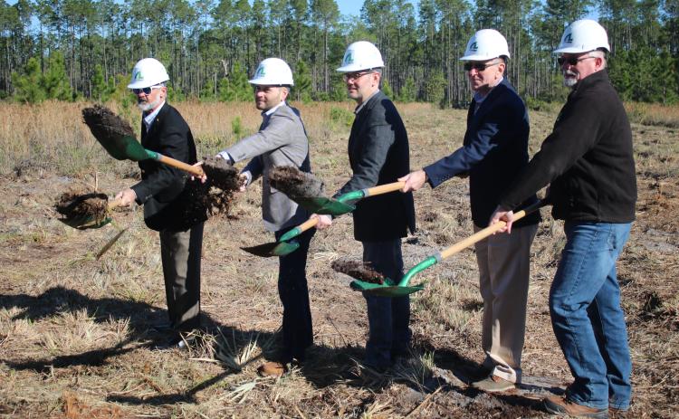 AgroLiquid adminstrators David Gilliam (from left), Gerrit Bancroft, Nick Bancroft, Alan Kennedy and Todd Cressman toss dirt from their shovels during a March groundbreaking ceremony for the company’s new plant at the North Florida Mega Industrial Park. (FILE)
