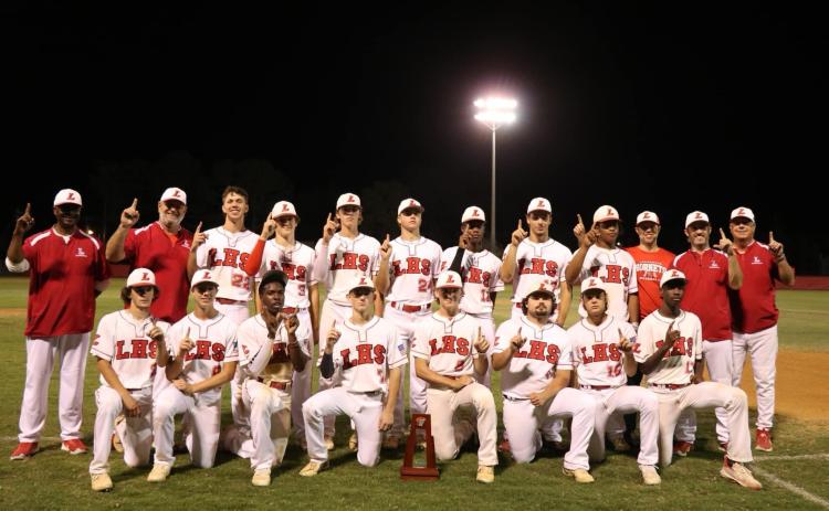 The Lafayette Hornets pose with the District 6-1A championship trophy after defeating Union County 2-1 on Thursday. (COURTESY)